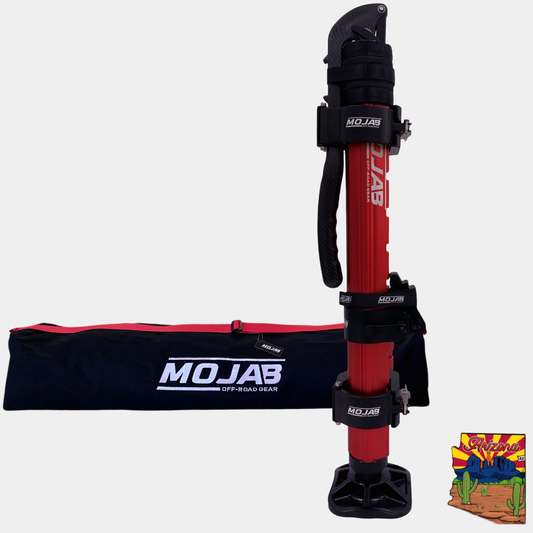 A CarbonPro hydraulic jack with red and black color scheme, including mounting clamps and a storage bag for Offroad