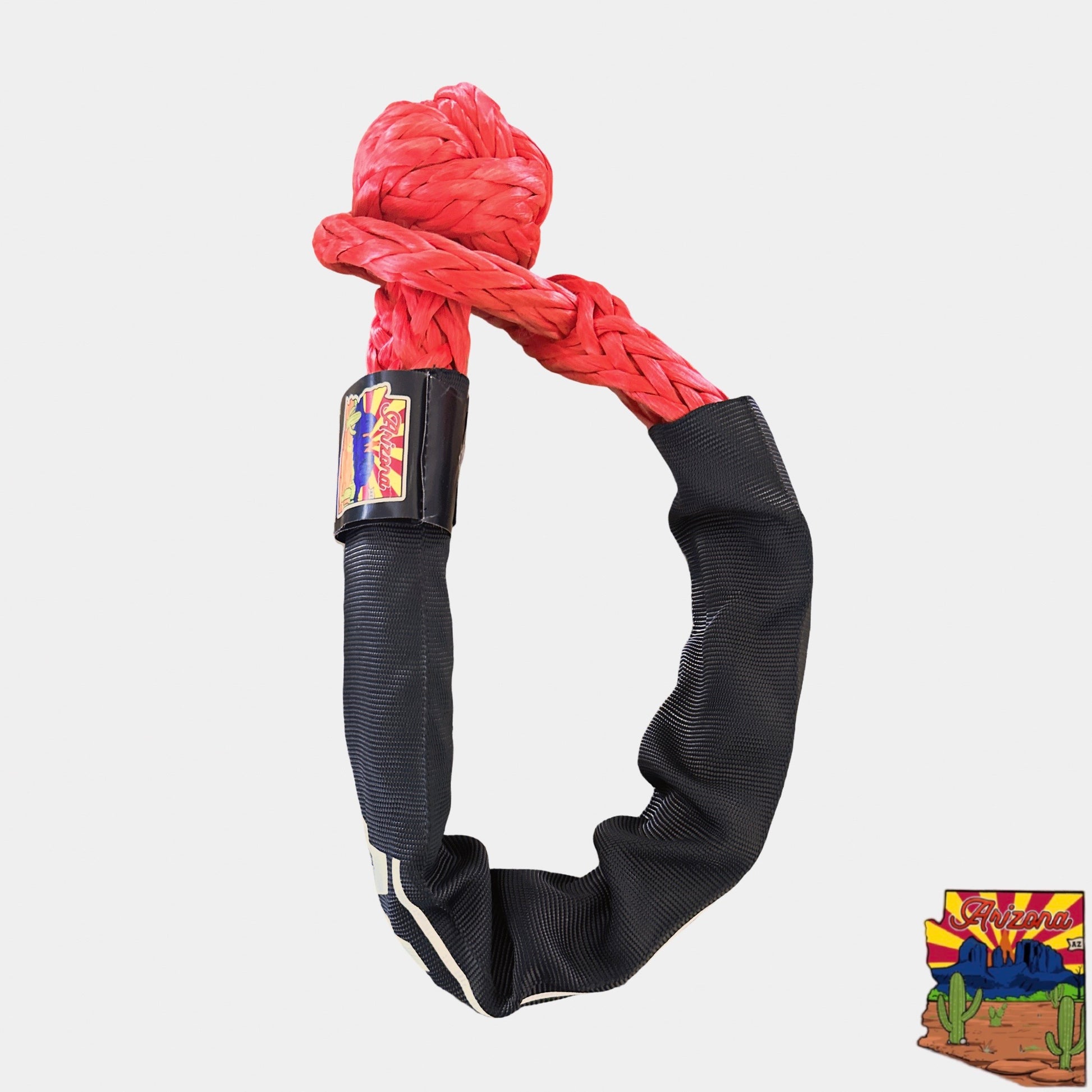 Red and black dog toy with a brand logo on a light gray background